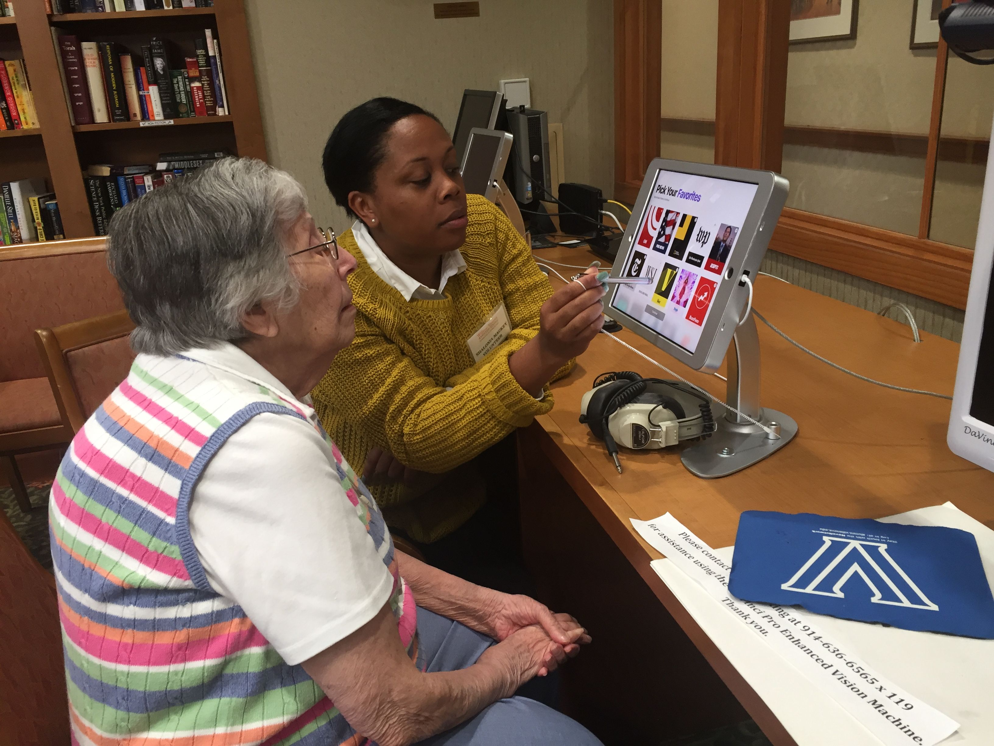 Elderly Woman Using the Computer in the Library 