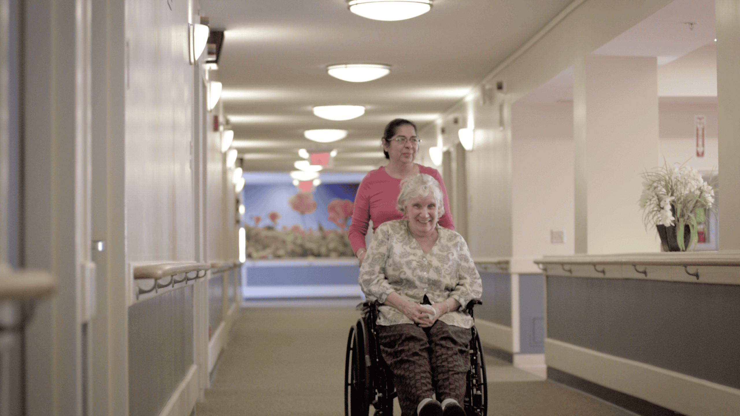 UHGC Nurse With Elderly Woman In Nursing Home
